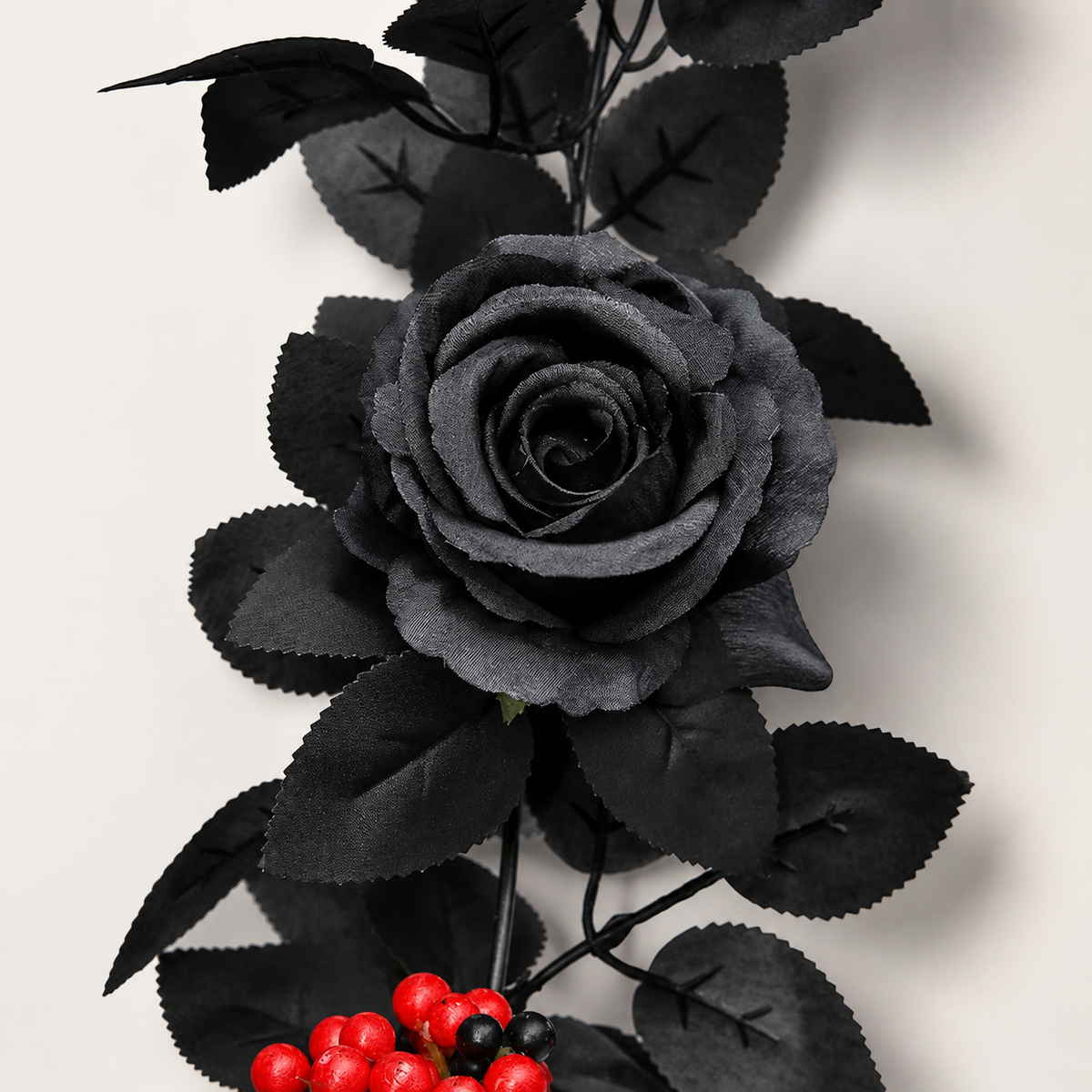 Black rose red berry garland detail